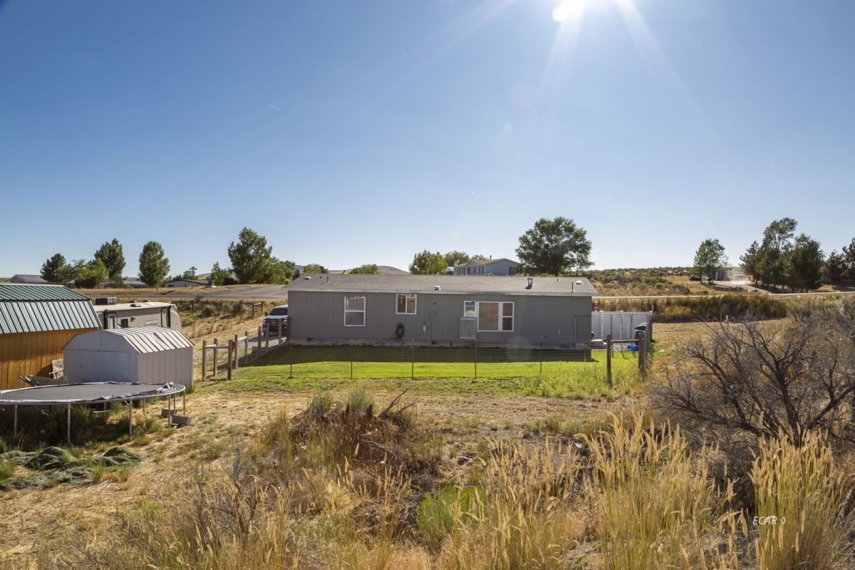 426 Spring Valley Parkway Spring Creek, NV 89815 - Photo 14 of 16 a view of swimming pool with outdoor seating and yard in the back
