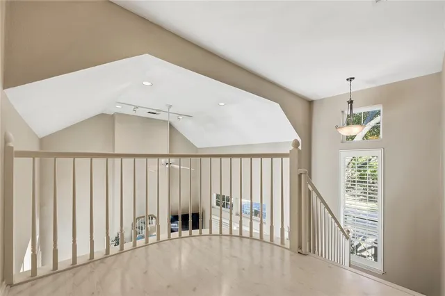 a view of a hallway with windows