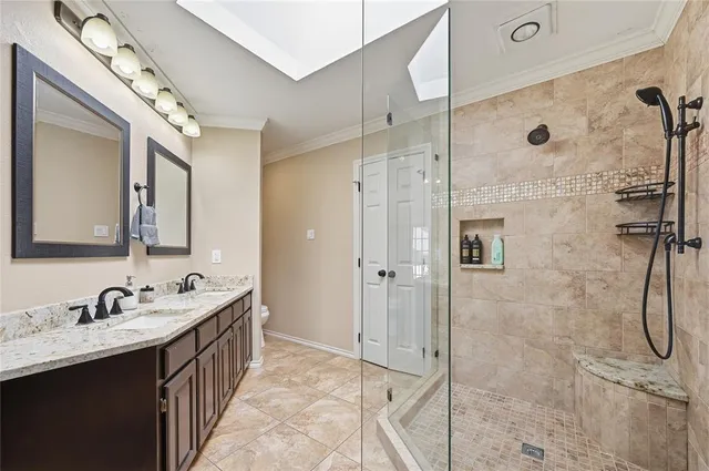 a bathroom with a double vanity sink mirror and double