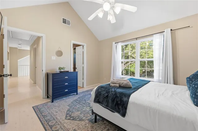 a bedroom with a bed and a dresser