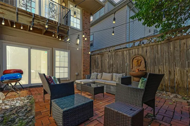 a outdoor space with patio the couches and a potted plant on the table