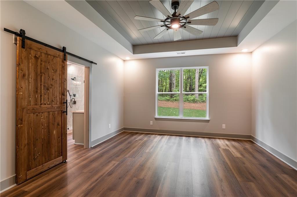 6 Lowe Lane Talking Rock, GA 30175 - Photo 7 of 10 wooden floor in an empty room with a window