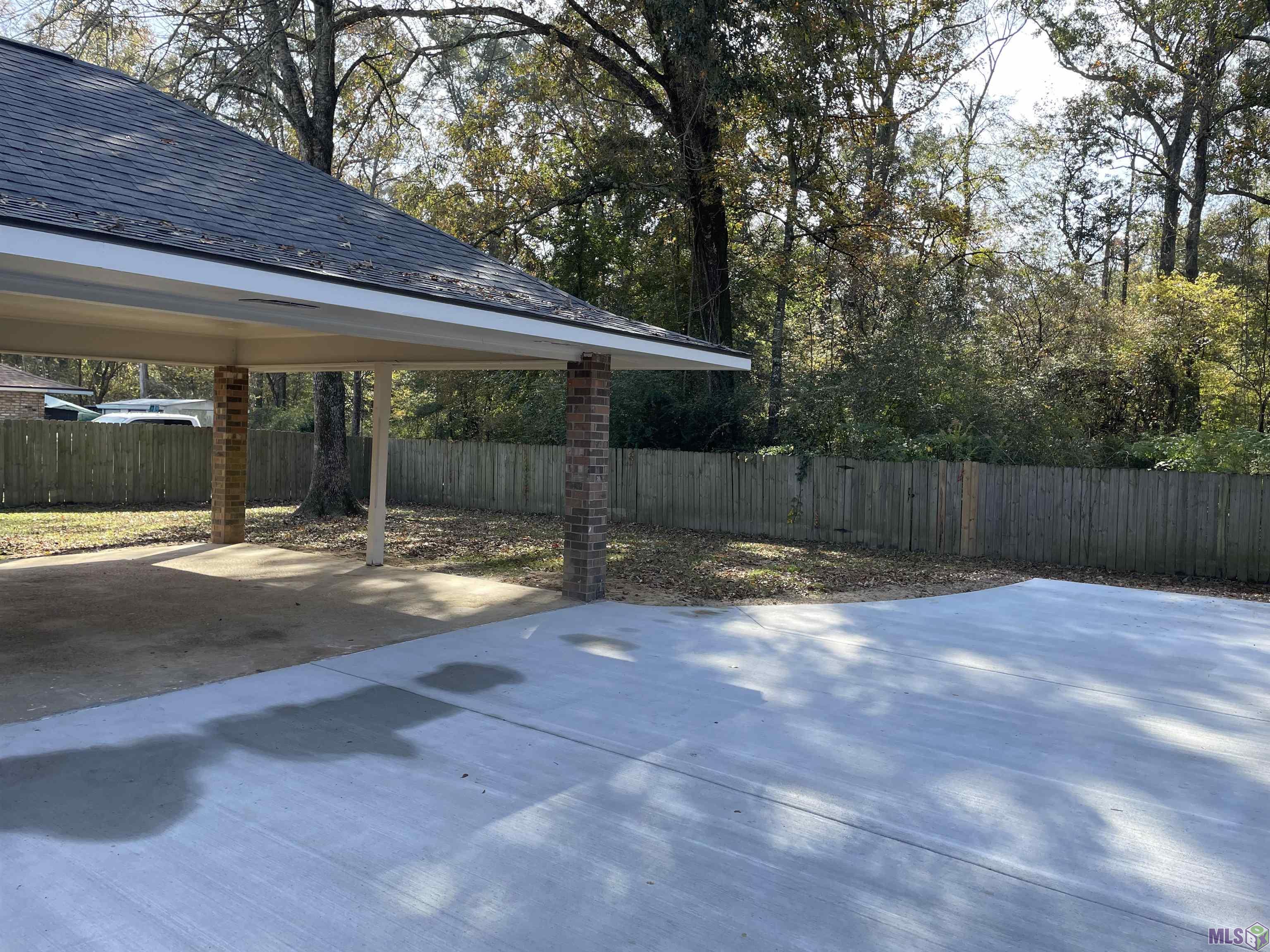 9734 Hardwood Drive Baton Rouge, LA 70818 - Photo 6 of 26 Back carport/extra driveway chute