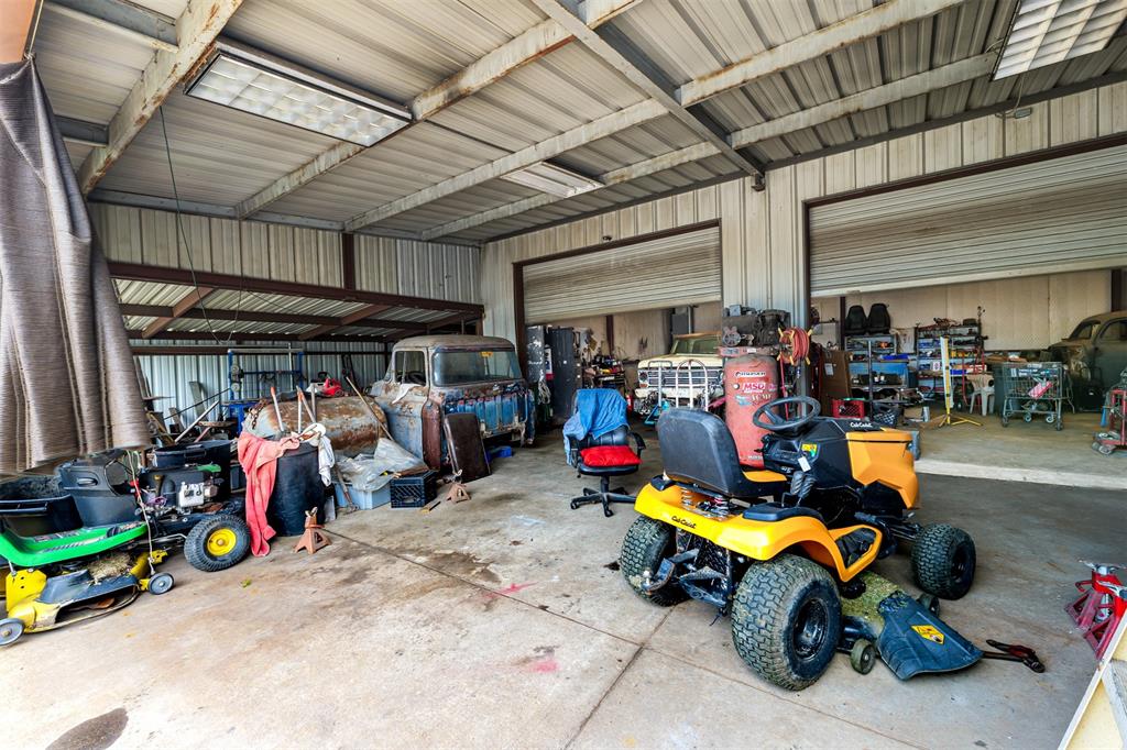 601 Houston School Road Red Oak, TX 75154 - Photo 20 of 32 Garage with metal wall