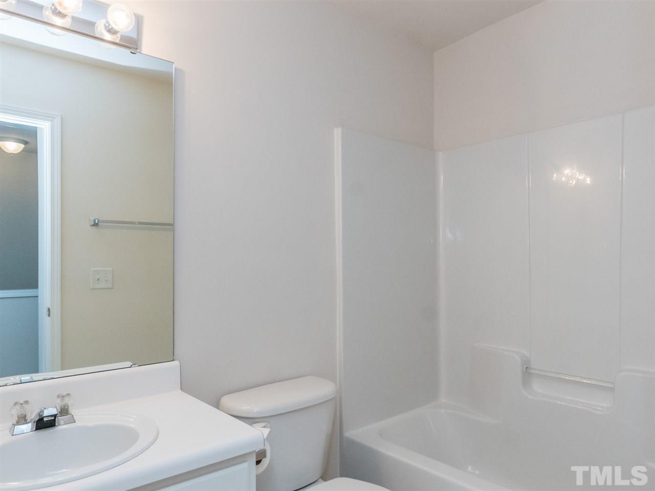 8518 Mt Valley Lane Raleigh, NC 27613 - Photo 14 of 20 a bathroom with a sink a toilet and shower