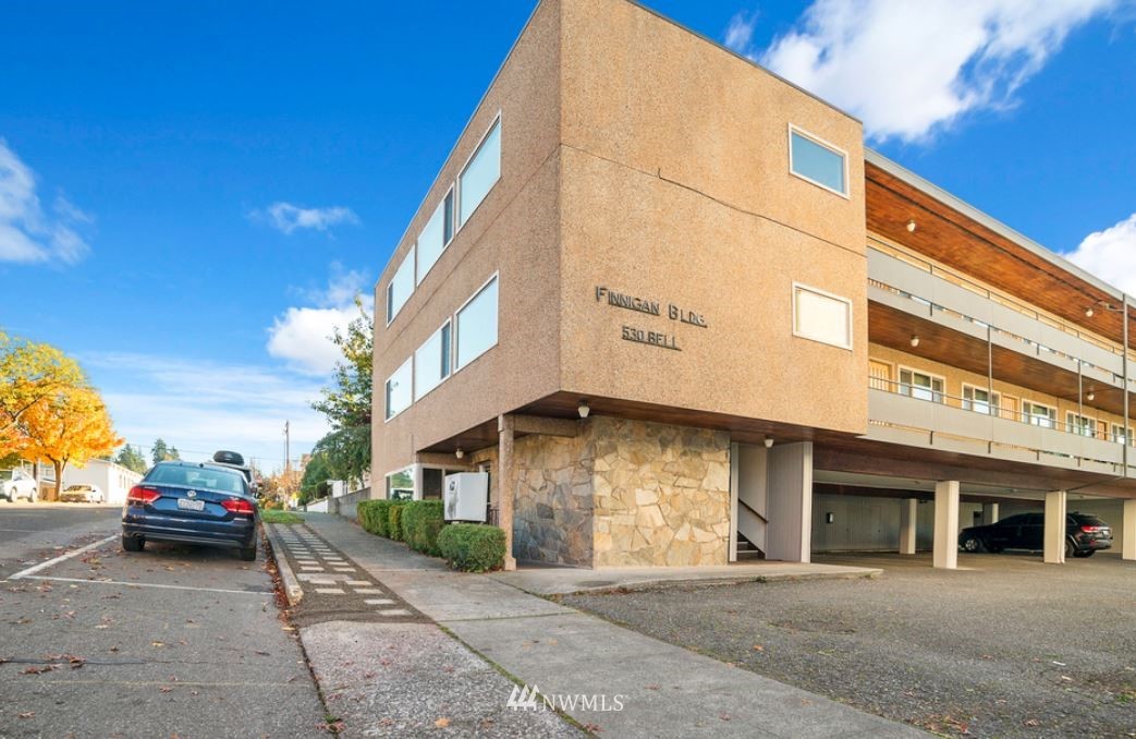 a view of a car park in front of building