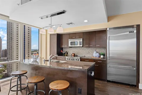 a kitchen with a sink stove and refrigerator