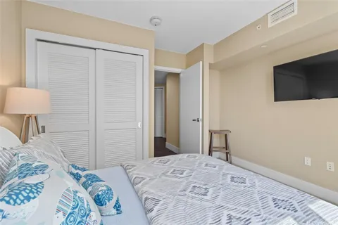 a bedroom with a bed and a lamp