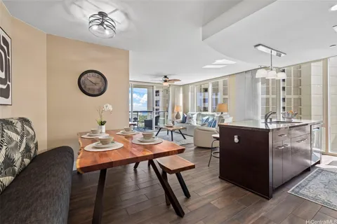 a view of a dining room with furniture window and wooden floor