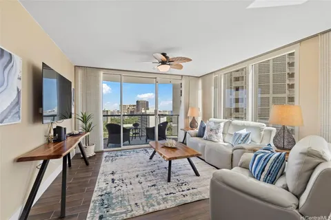 a living room with furniture and a large window