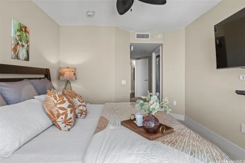 a bedroom with bed and glass windows