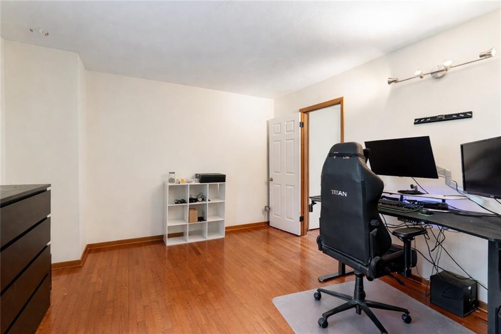 420 Spring Run Drive Monroeville, PA 15146 - Photo 19 of 24 a view of a workspace with furniture and wooden floor