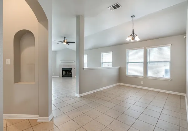 a kitchen with stainless steel appliances granite countertop a sink and a stove top oven with wooden floor