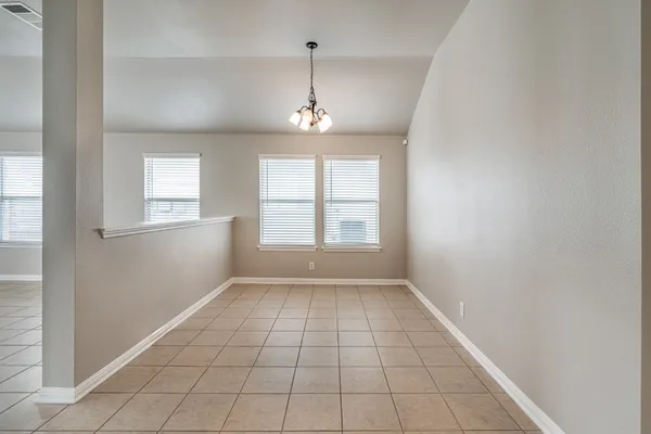 a kitchen with stainless steel appliances granite countertop a refrigerator stove and microwave
