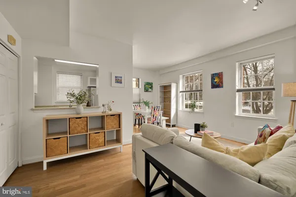 a living room with furniture and windows