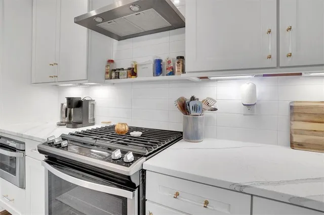 a spacious bedroom with a bed and a window