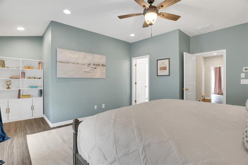 775 Hamilton Circle Southeast Atlanta, GA 30312 - Photo 15 of 24 a bedroom with a bed and a chandelier