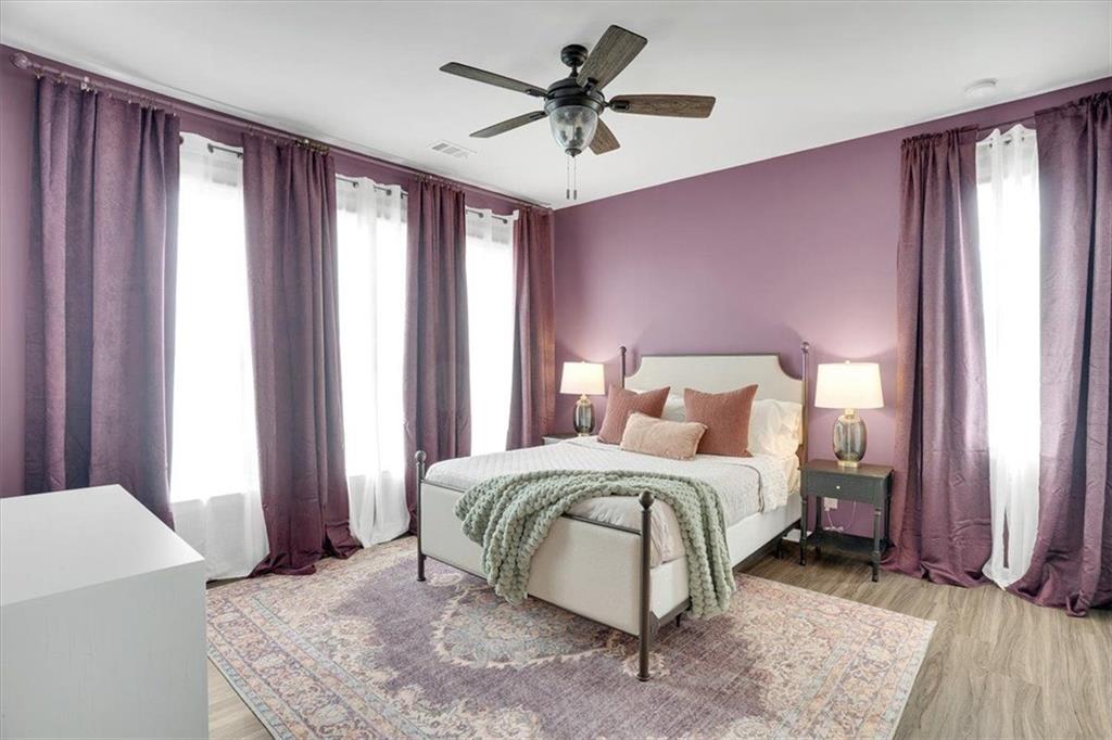 775 Hamilton Circle Southeast Atlanta, GA 30312 - Photo 21 of 24 a bedroom with a bed and a chandelier