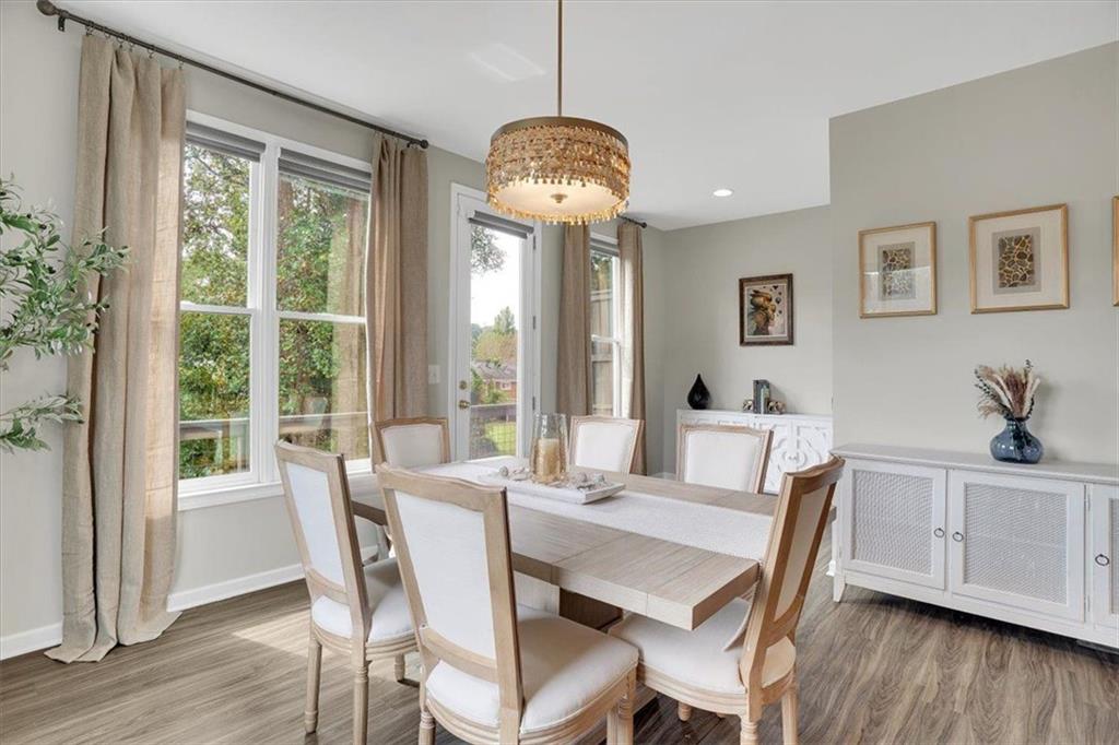 775 Hamilton Circle Southeast Atlanta, GA 30312 - Photo 9 of 24 a dining room with furniture window wooden floor