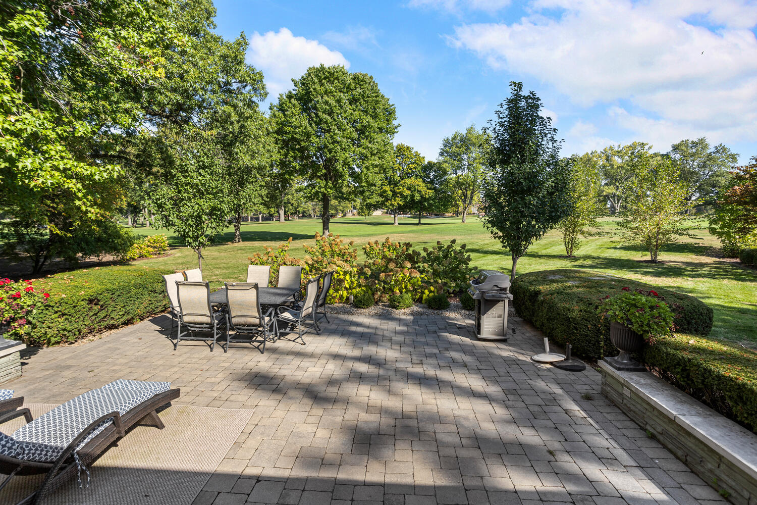7 Greencroft Drive Champaign, IL 61821 - Photo 36 of 44 a view of a table and chairs in the garden