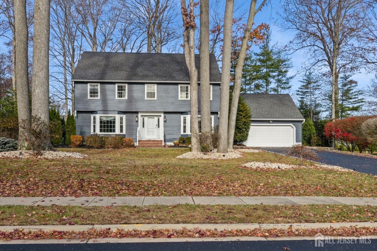 957 Hoover Drive North Brunswick, NJ 08902 - Photo 1 of 73 a front view of a house with a yard