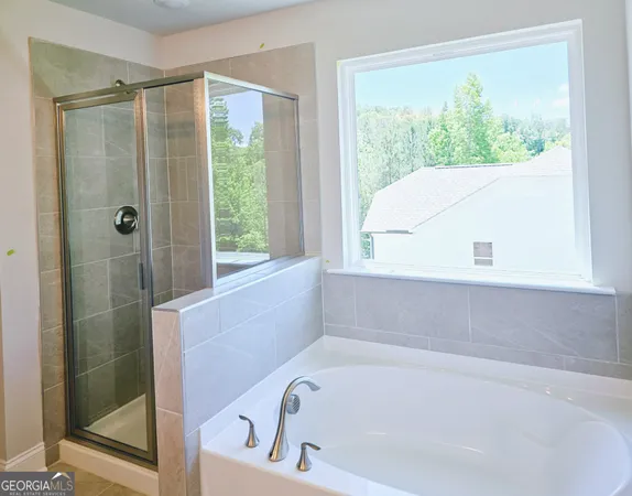 a bathroom with a bathtub and window