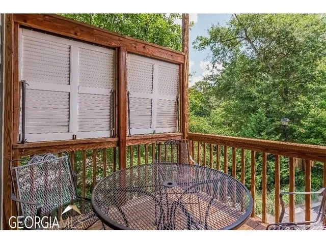 a view of balcony with wooden floor