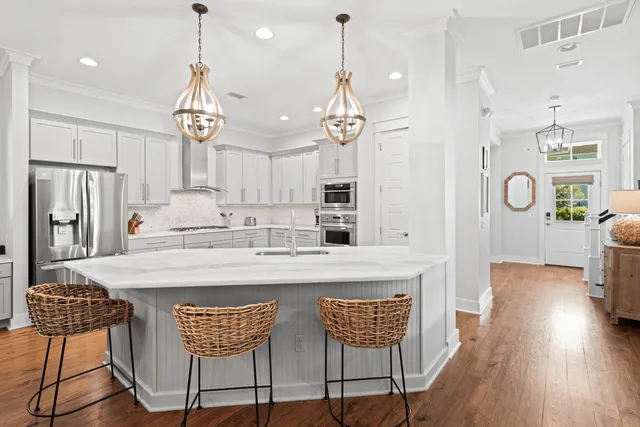a kitchen with refrigerator cabinets and a sink