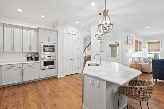 a kitchen with granite countertop cabinets stainless steel appliances and a sink