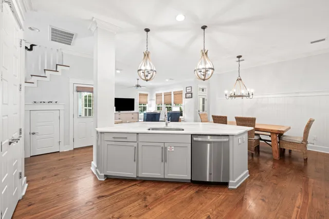 a bedroom with a bed flat screen tv and window