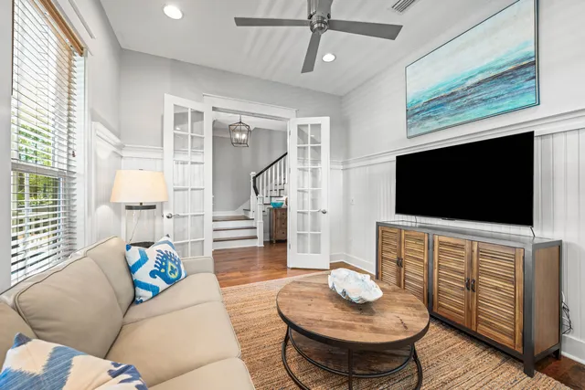 a living room with furniture and a large window