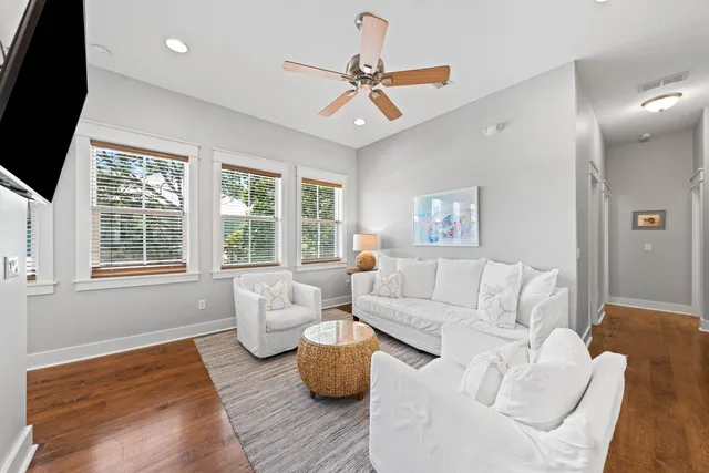 a bathroom with a granite countertop sink toilet mirror and shower