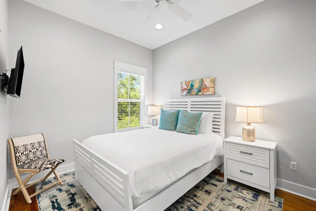 a bathroom with a granite countertop bathtub sink vanity and shower