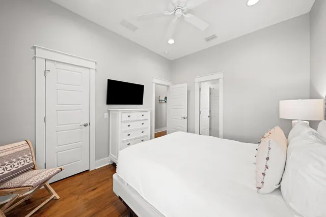 a bathroom with a granite countertop sink a toilet and shower