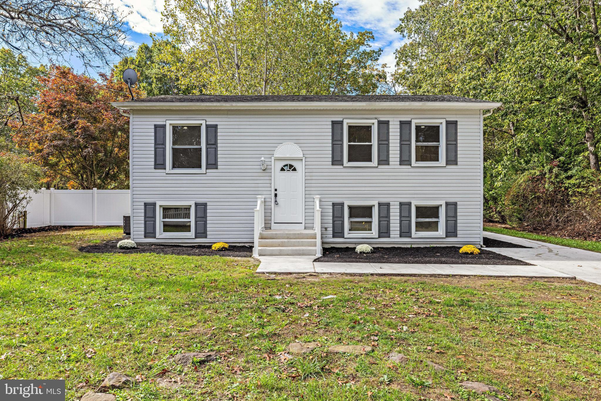 716 6th Road Newtonville, NJ 08346 - Photo 1 of 40 a view of a house with a patio and a yard