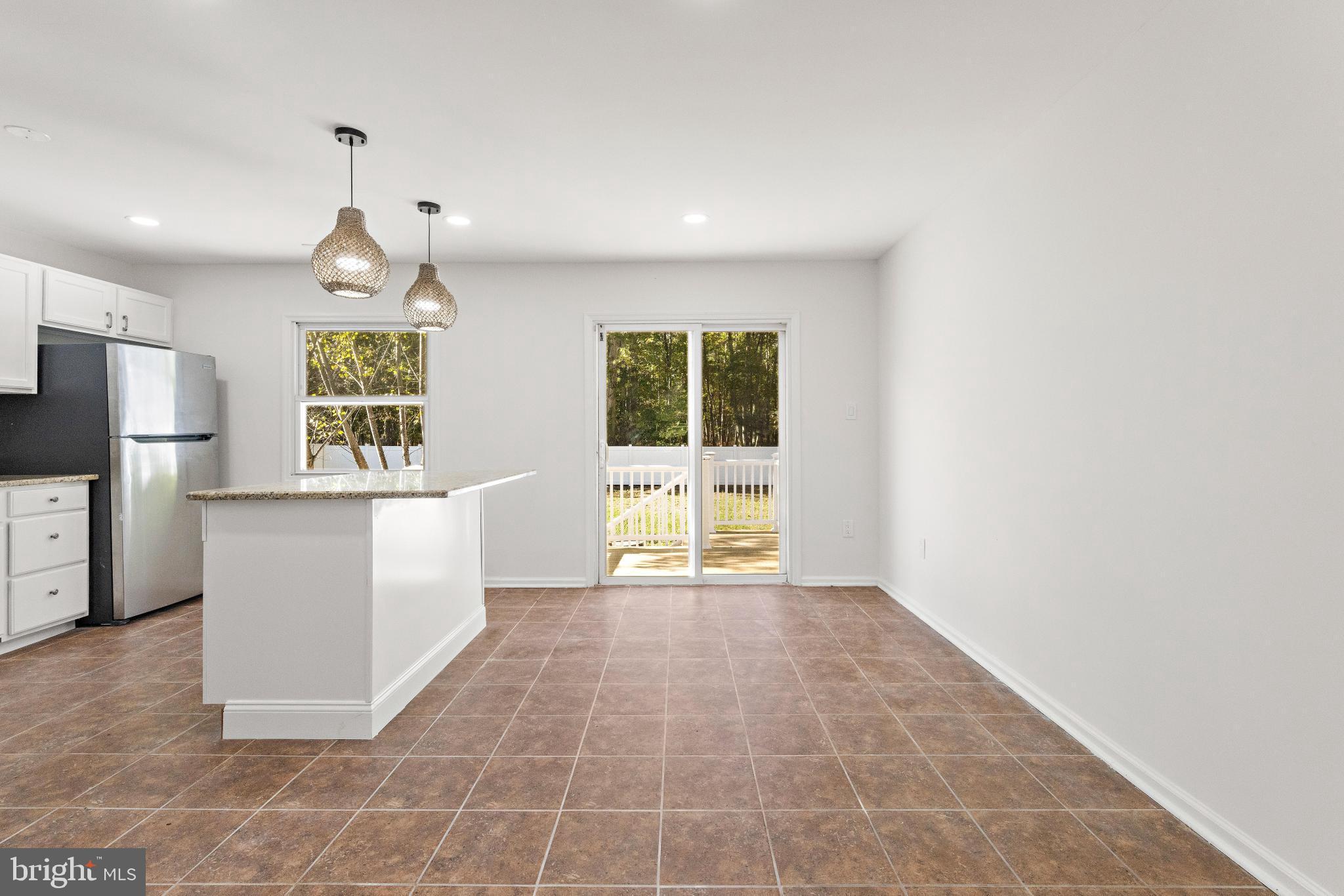 716 6th Road Newtonville, NJ 08346 - Photo 11 of 40 a view of an empty room with a window