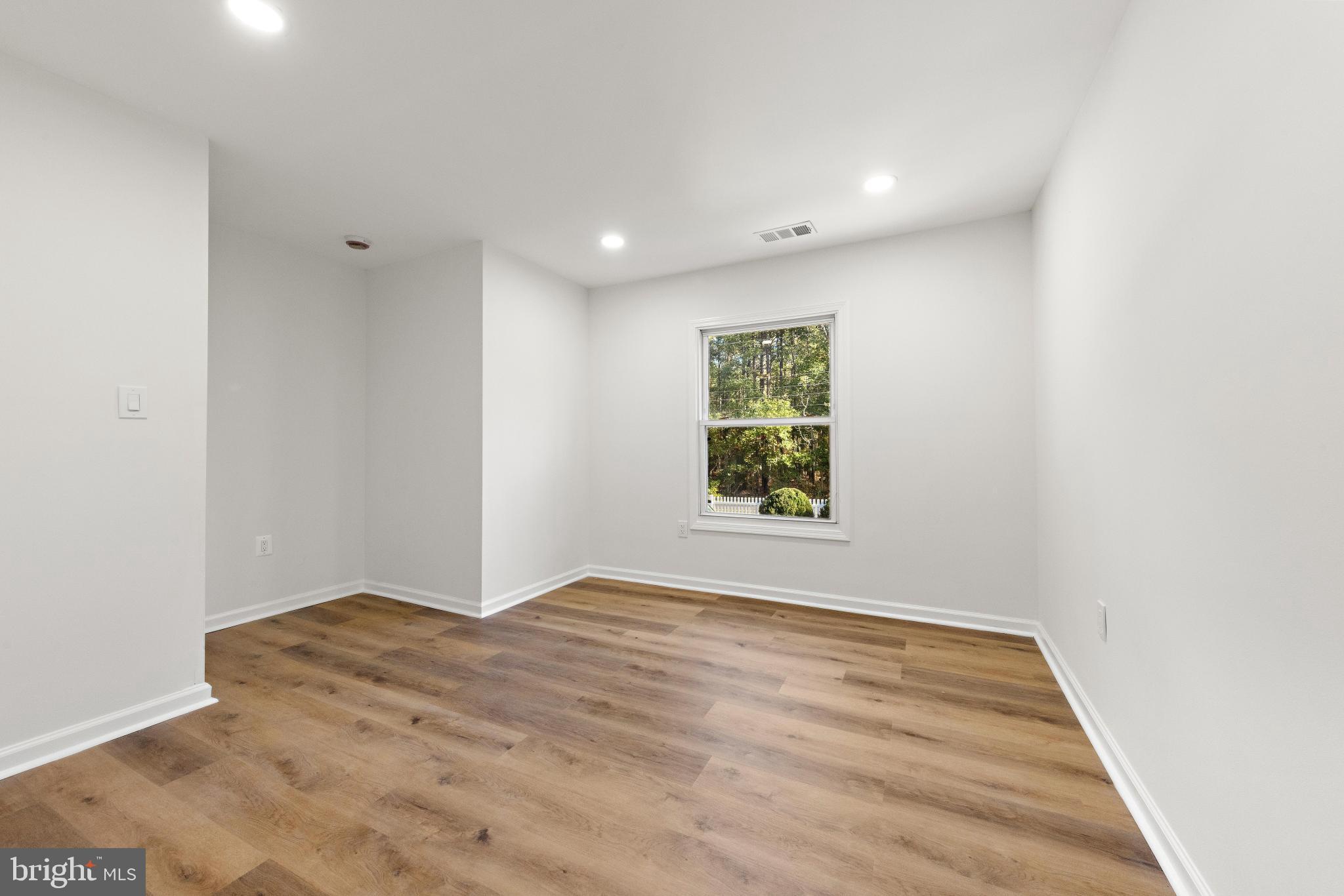 716 6th Road Newtonville, NJ 08346 - Photo 16 of 40 a view of room with window and hardwood floor