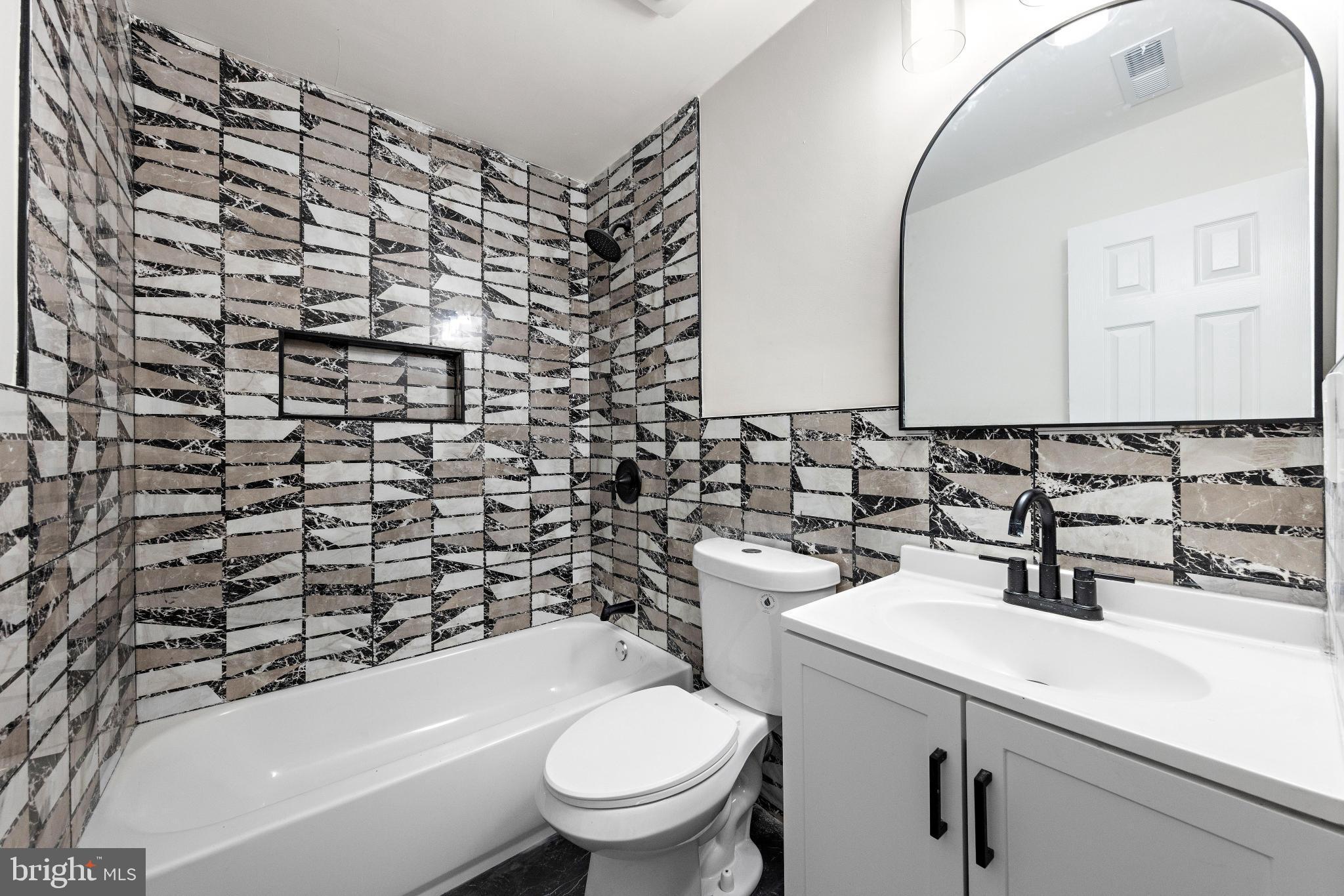 716 6th Road Newtonville, NJ 08346 - Photo 18 of 40 a bathroom with a sink a toilet and shower