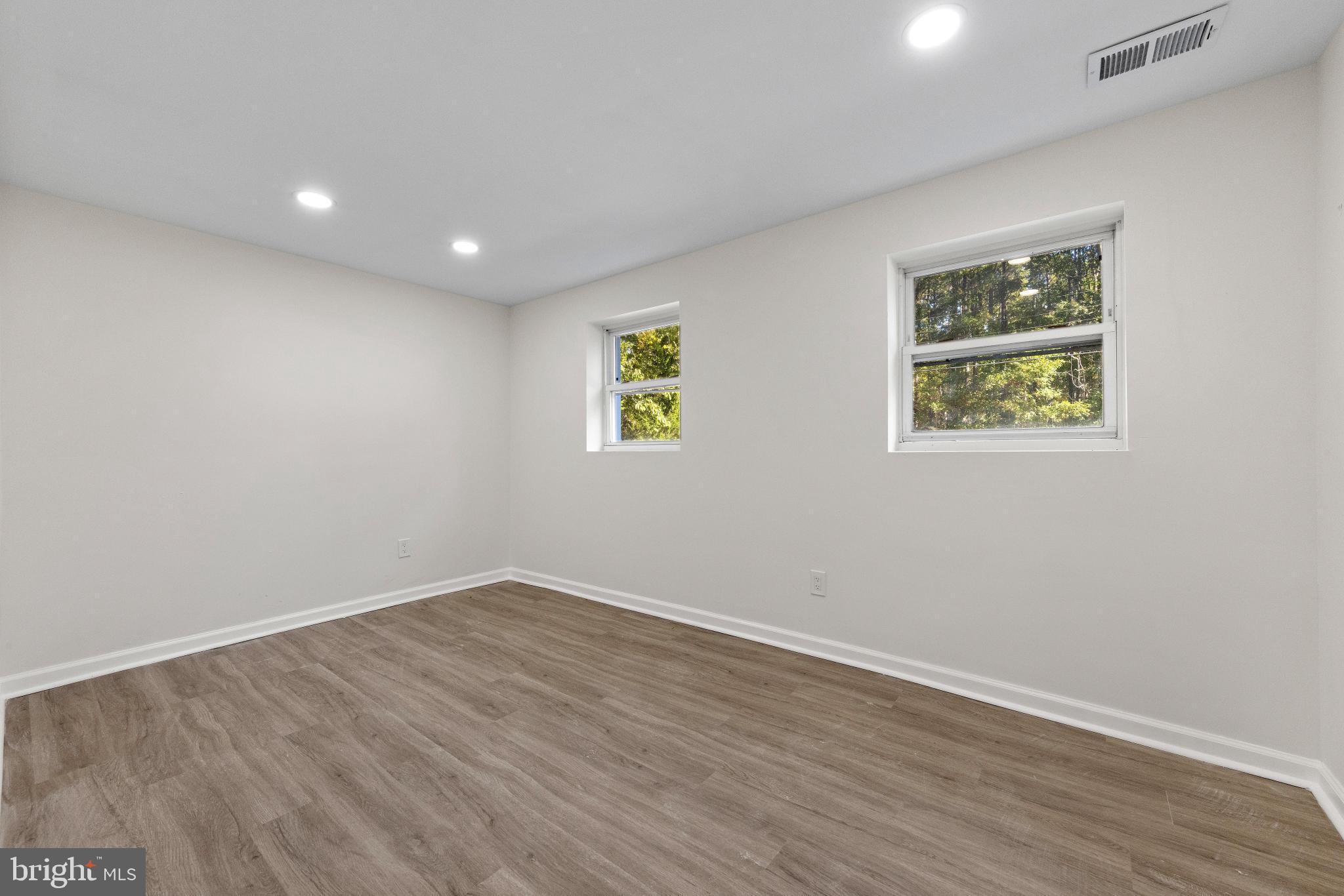 716 6th Road Newtonville, NJ 08346 - Photo 19 of 40 a view of room with wooden floor and window