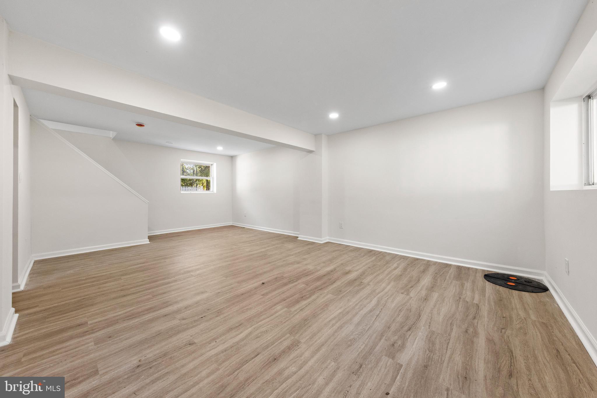 716 6th Road Newtonville, NJ 08346 - Photo 22 of 40 an empty room with wooden floor and windows