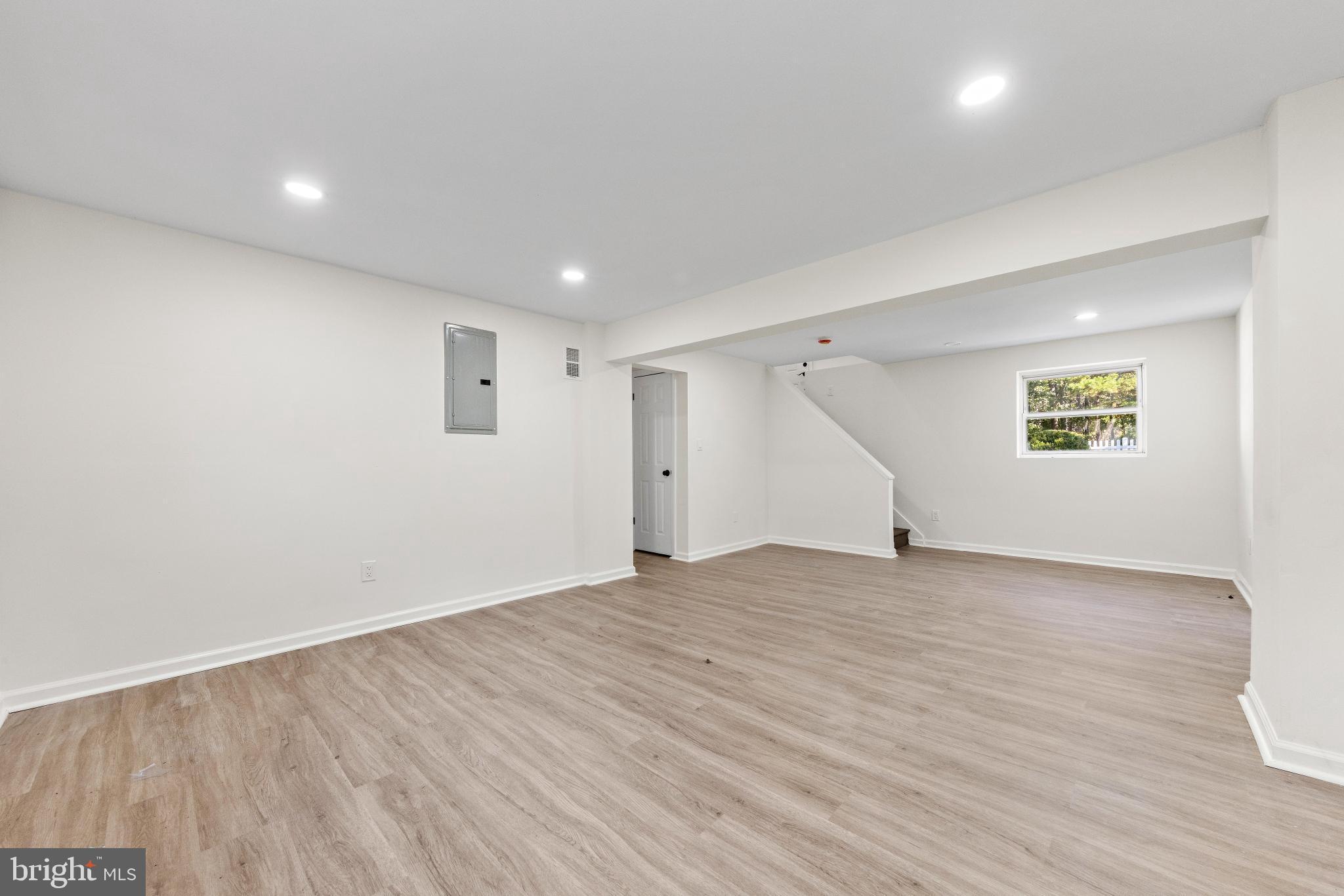 716 6th Road Newtonville, NJ 08346 - Photo 23 of 40 a view of an empty room with wooden floor and a ceiling fan