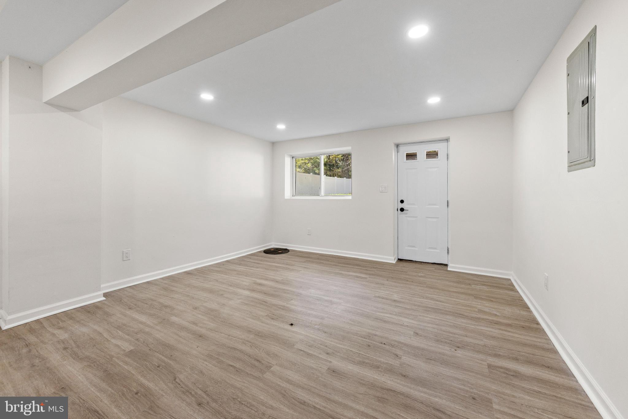 716 6th Road Newtonville, NJ 08346 - Photo 24 of 40 an empty room with wooden floor and window