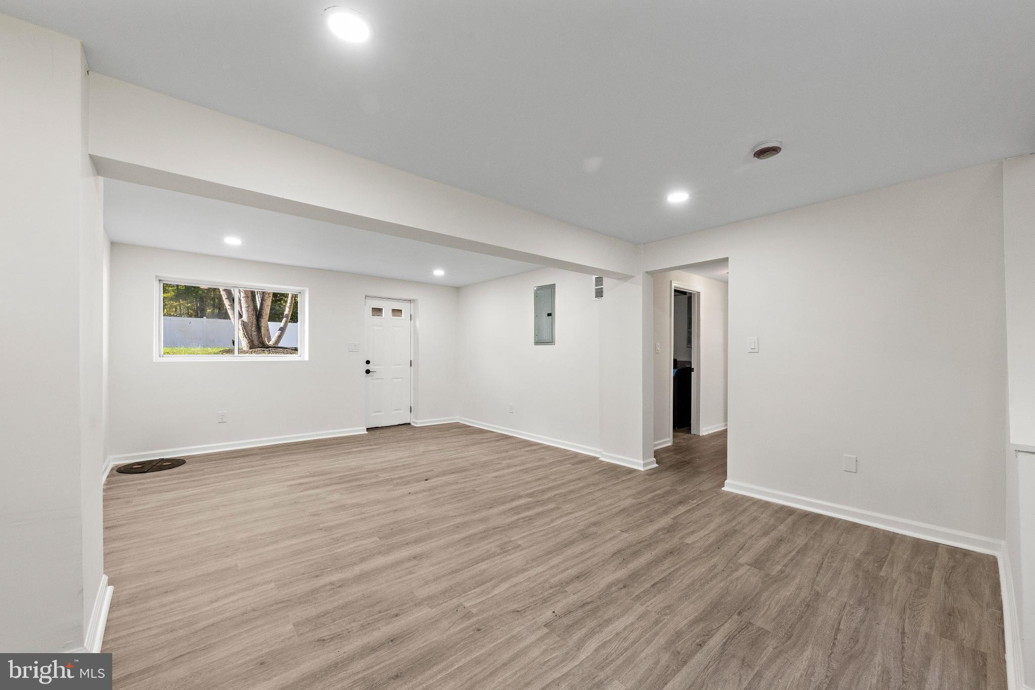 716 6th Road Newtonville, NJ 08346 - Photo 26 of 40 a view of an empty room with wooden floor and a window