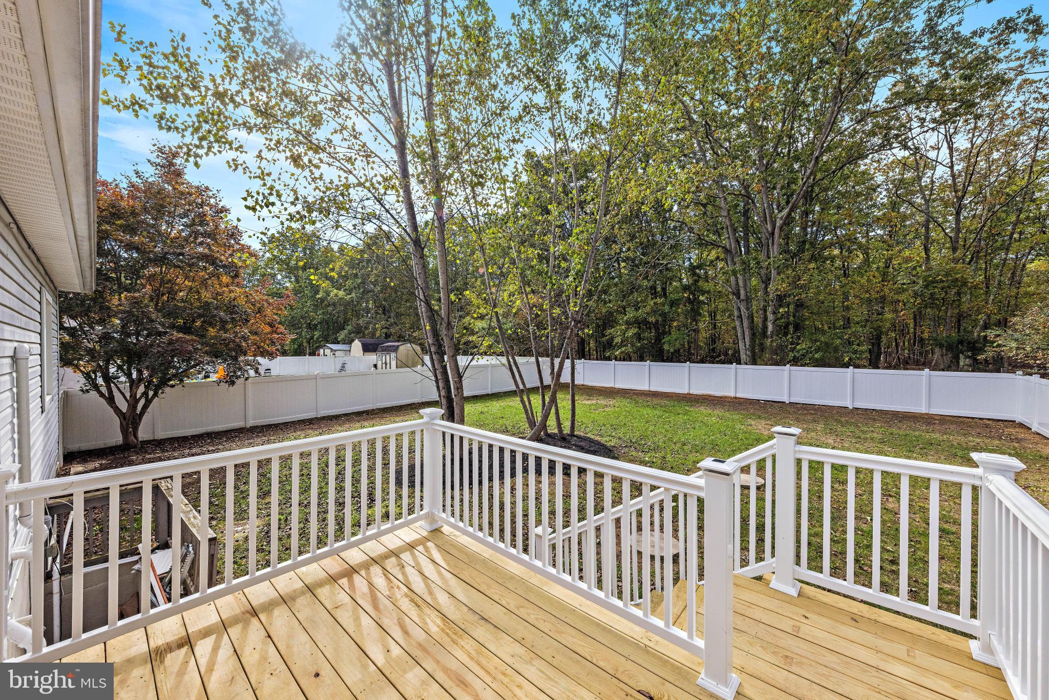 716 6th Road Newtonville, NJ 08346 - Photo 30 of 40 a view of balcony with wooden floor and fence