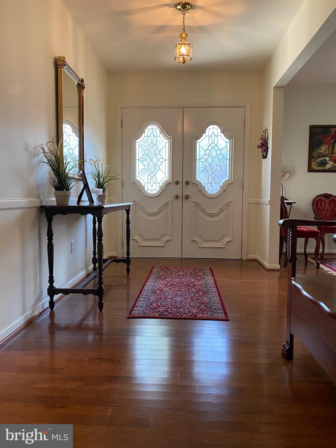 9424 Dunloggin Road Ellicott City, MD 21042 - Photo 18 of 48 Entry foyer with beautiful hardwood floors!