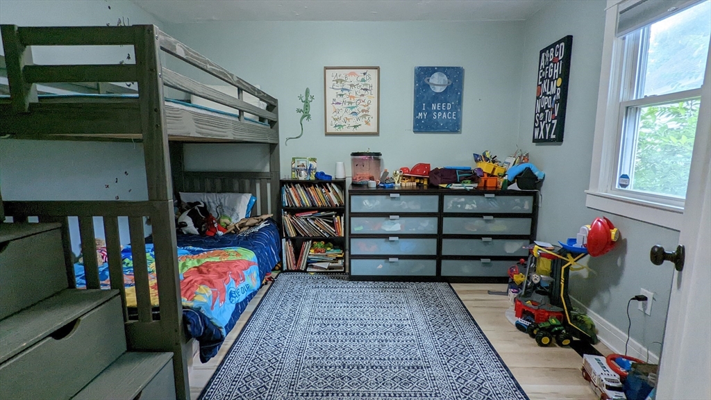 76 Milk Street, Unit 1 Westborough, MA 01581 - Photo 15 of 19 a room with wooden furniture and toys