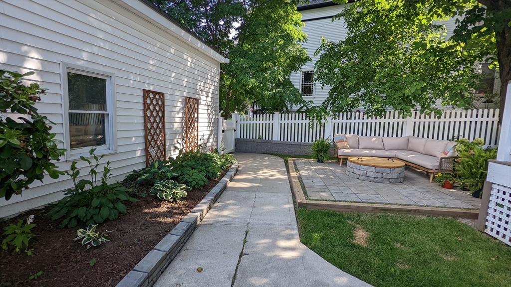 76 Milk Street, Unit 1 Westborough, MA 01581 - Photo 16 of 19 a garden view with a seating space