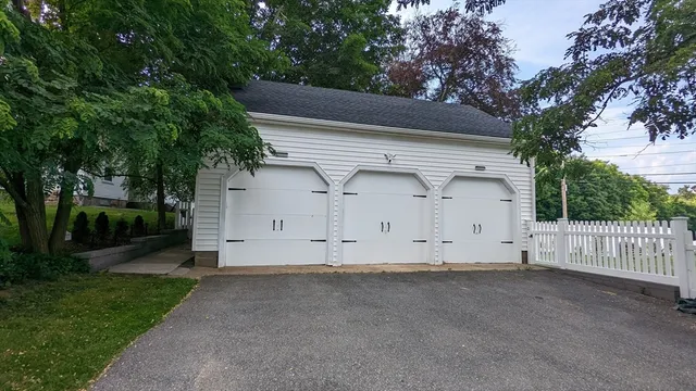a view of garage and yard