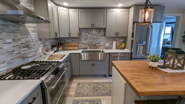 a kitchen with a stove and a refrigerator