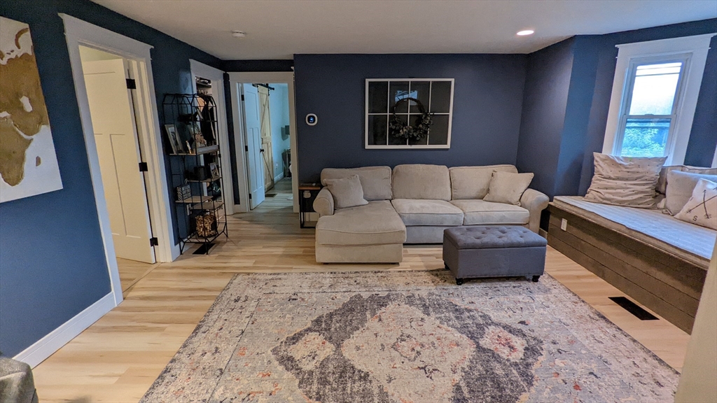 76 Milk Street, Unit 1 Westborough, MA 01581 - Photo 8 of 19 a living room with furniture and a window
